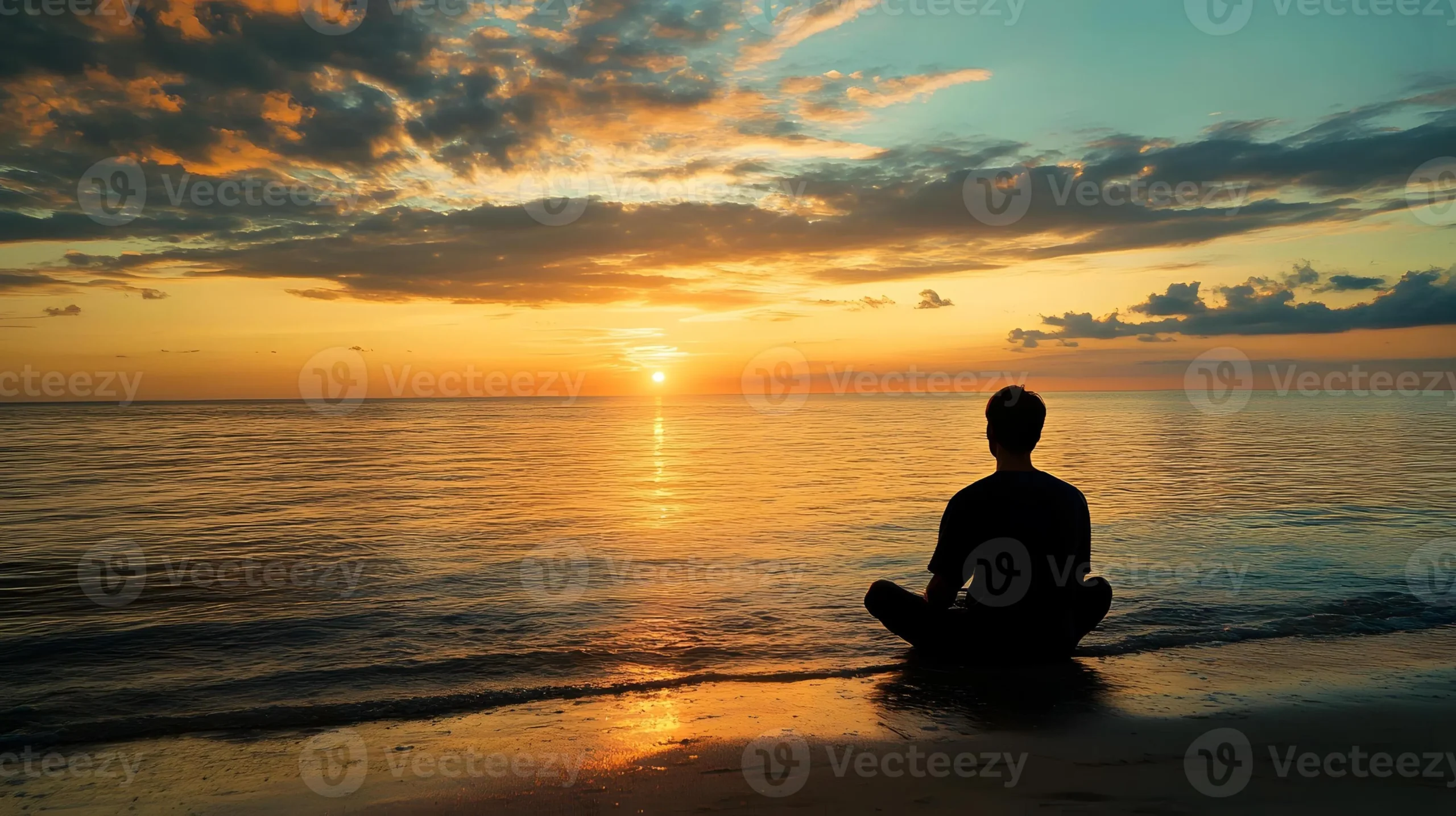 a-person-sitting-in-meditation-on-the-beach-at-sunset-photo-scaled-1 Sự tha thứ mang lại sự bình yên nội tại giúp chúng ta giải phóng bản thân khỏi những xiềng xích của quá khứ